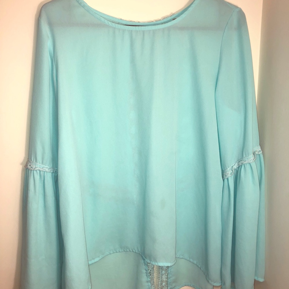 Light blue flowy blouse with crochet back